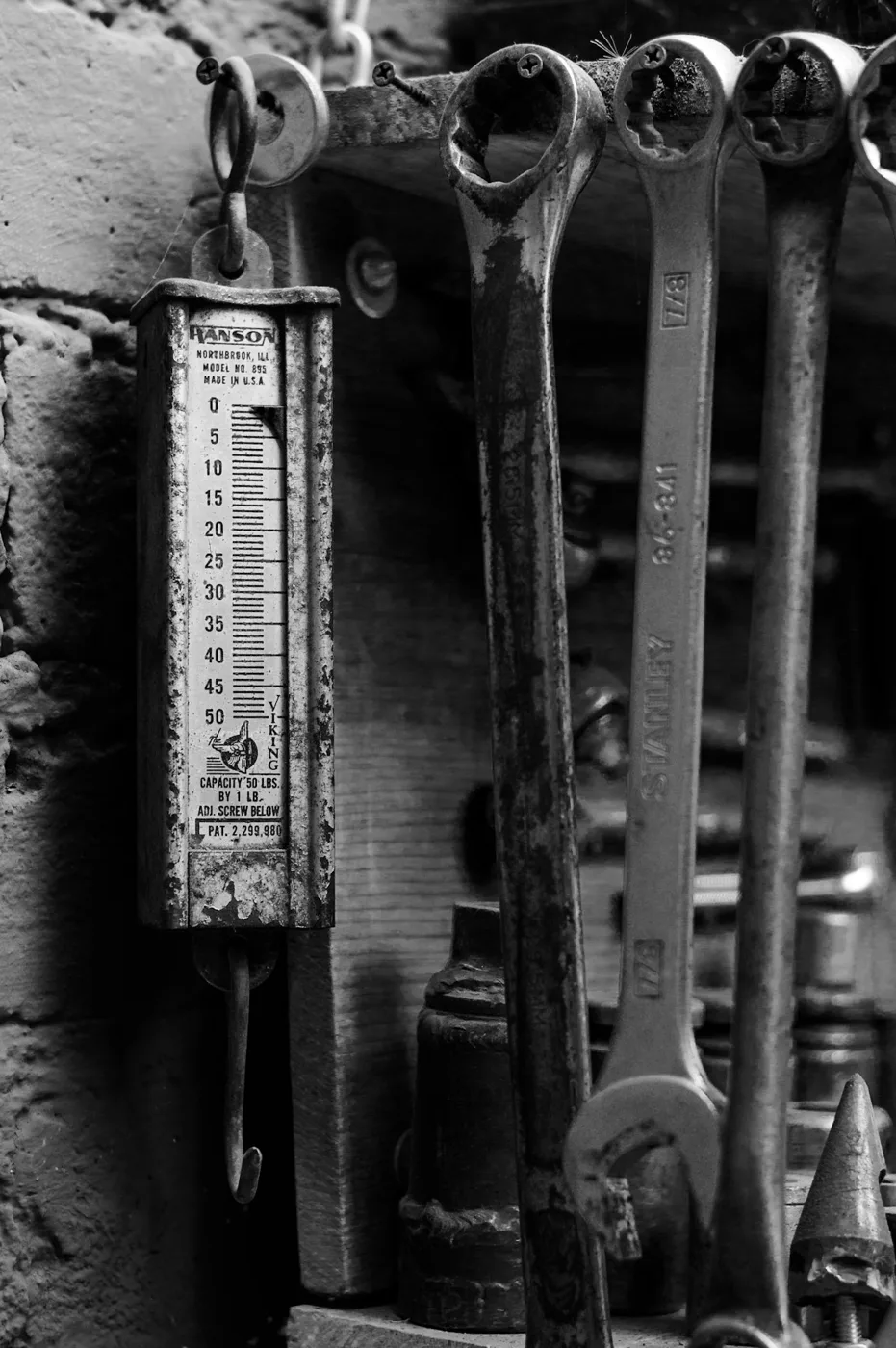 Workshop tools arranged on a weathered wall
